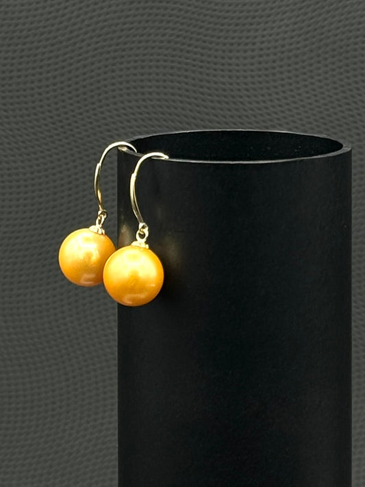 Cultured, South Sea, Pearl Earrings, exhibited on black cylinder, drop style, deep gold, sound reflection, 10-11mm,  18k yellow gold.