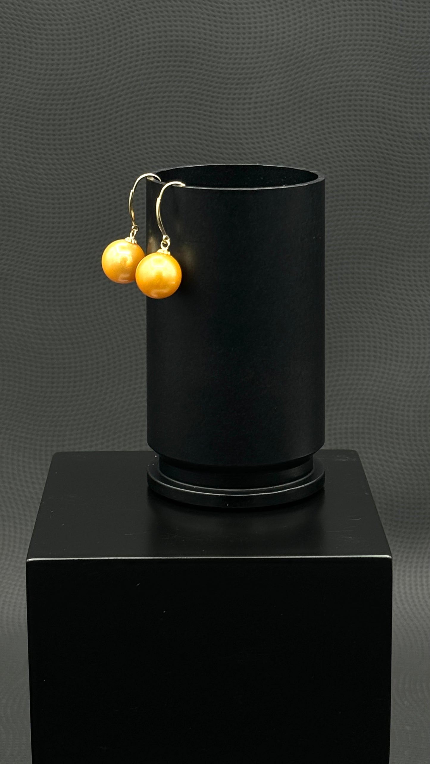 Cultured, South Sea, Pearl Earrings, exhibited on black box, drop style, deep gold, sound reflection, 10-11mm,  18k yellow gold.