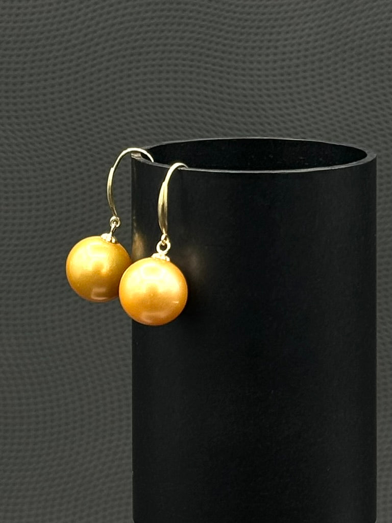 Cultured, South Sea, pearl earrings, exhibited on black cylinder, deep gold, drop style, sound reflection, 10-11mm, 18k yellow gold