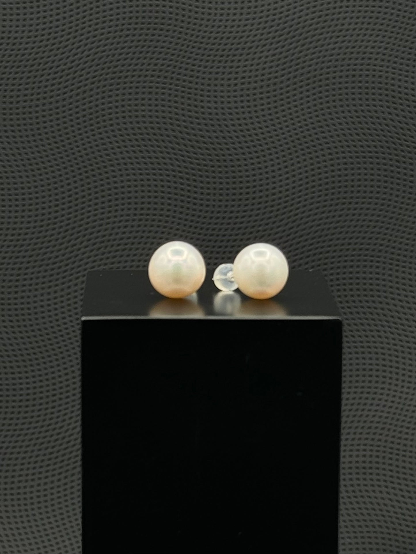 Cultured, South Sea, pearl earrings, exhibited on black box, white, stud style, sound reflection, 11.5mm, 18k white gold.