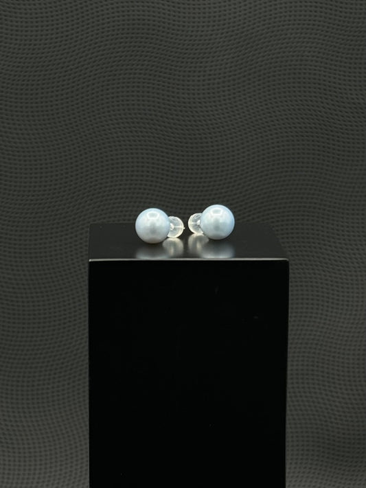 Cultured, South Sea, pearl earrings, exhibited on black box, light blue, stud style, excellent reflection, 10-11mm, 18k white gold.
