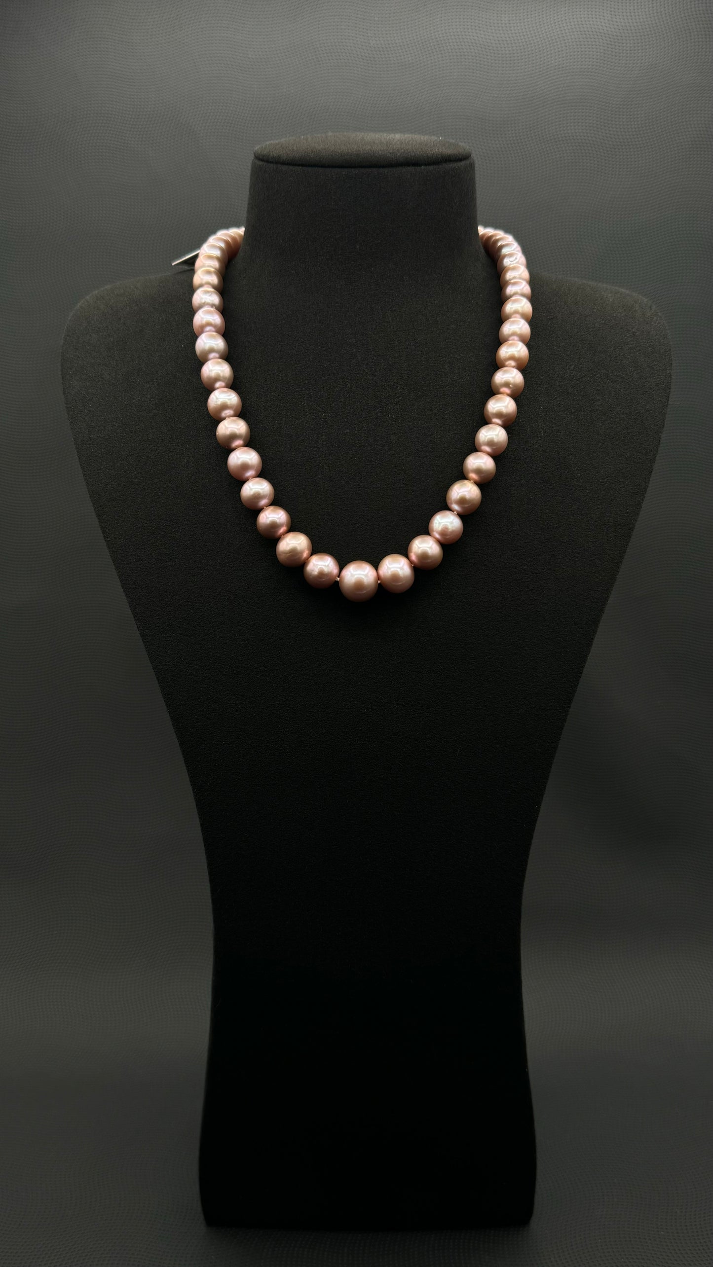 Cultured, South Sea lavender pearl strand necklace, exhibited on black suede, excellent reflection, 9-9.5mm, 18.5", sterling silver clasp.