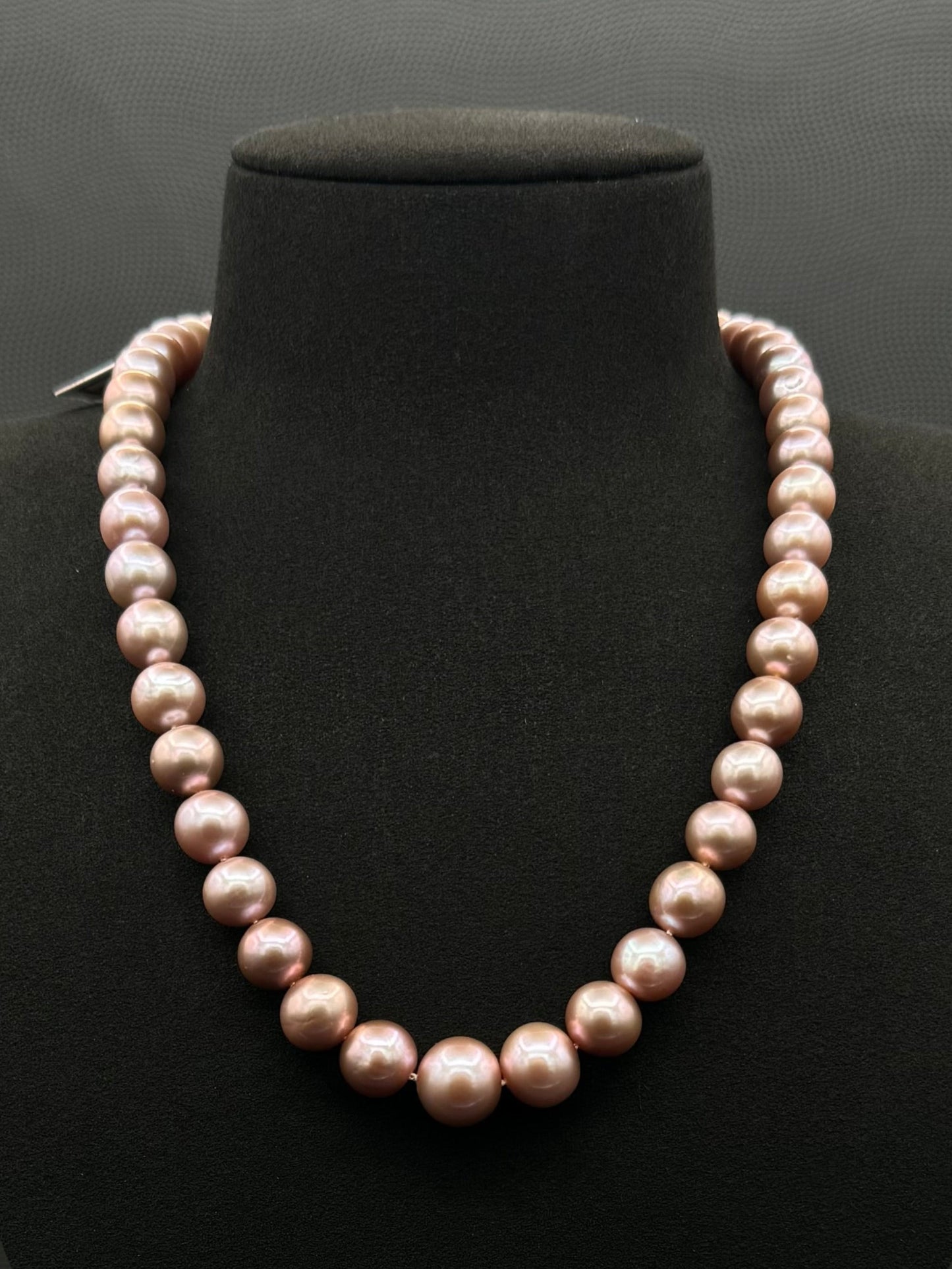 Cultured, South Sea lavender pearl strand necklace, exhibited on black suede, excellent reflection, 9-9.5mm, 18.5", sterling silver clasp.