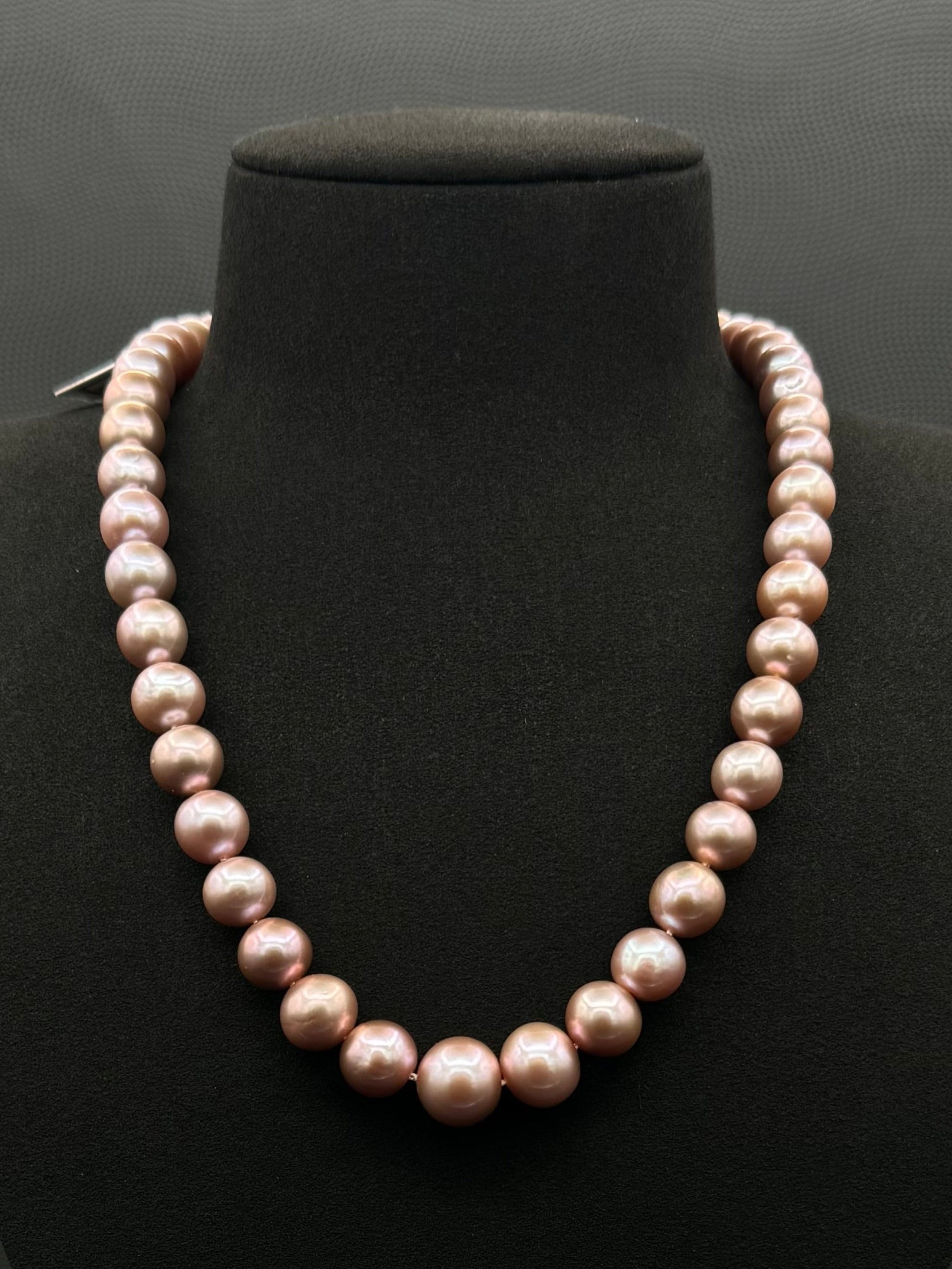 Cultured, South Sea lavender pearl strand necklace, exhibited on black suede, excellent reflection, 9-9.5mm, 18.5", sterling silver clasp.