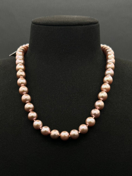Cultured, South Sea lavender pearl strand necklace, exhibited on black suede, excellent reflection, 9.5-12.5mm, 19", yellow gold clasp.