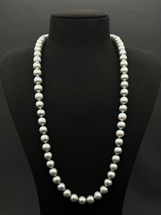Cultured, South Sea, soft grey continuous strand pearl necklace, exhibited on black suede, excellent reflection, 9.5-10.5mm, 26", no clasp.