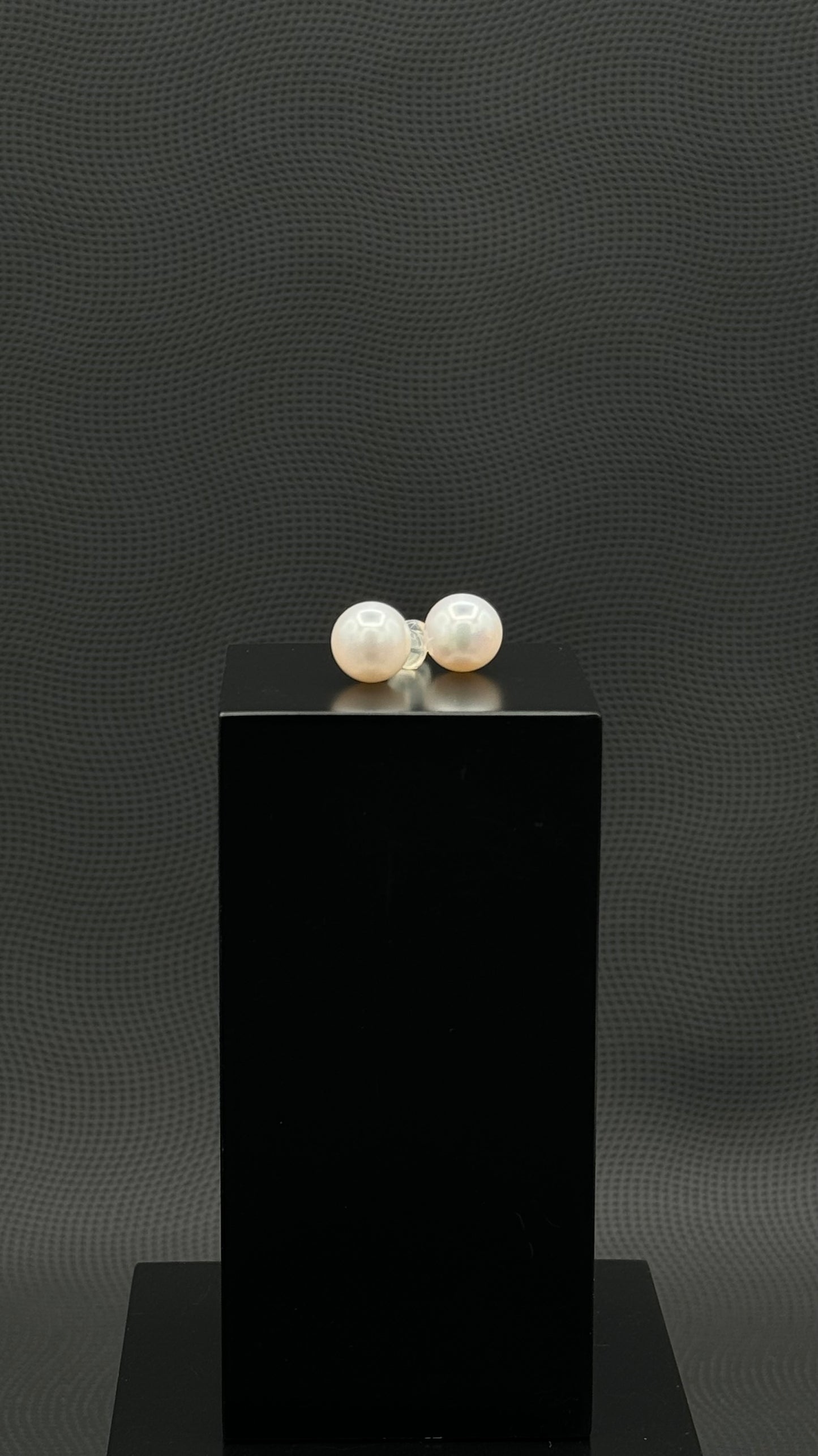 Cultured, South Sea, pearl earrings, exhibited on black box, white, stud style, extremely sharp, 11mm, 18k white gold.