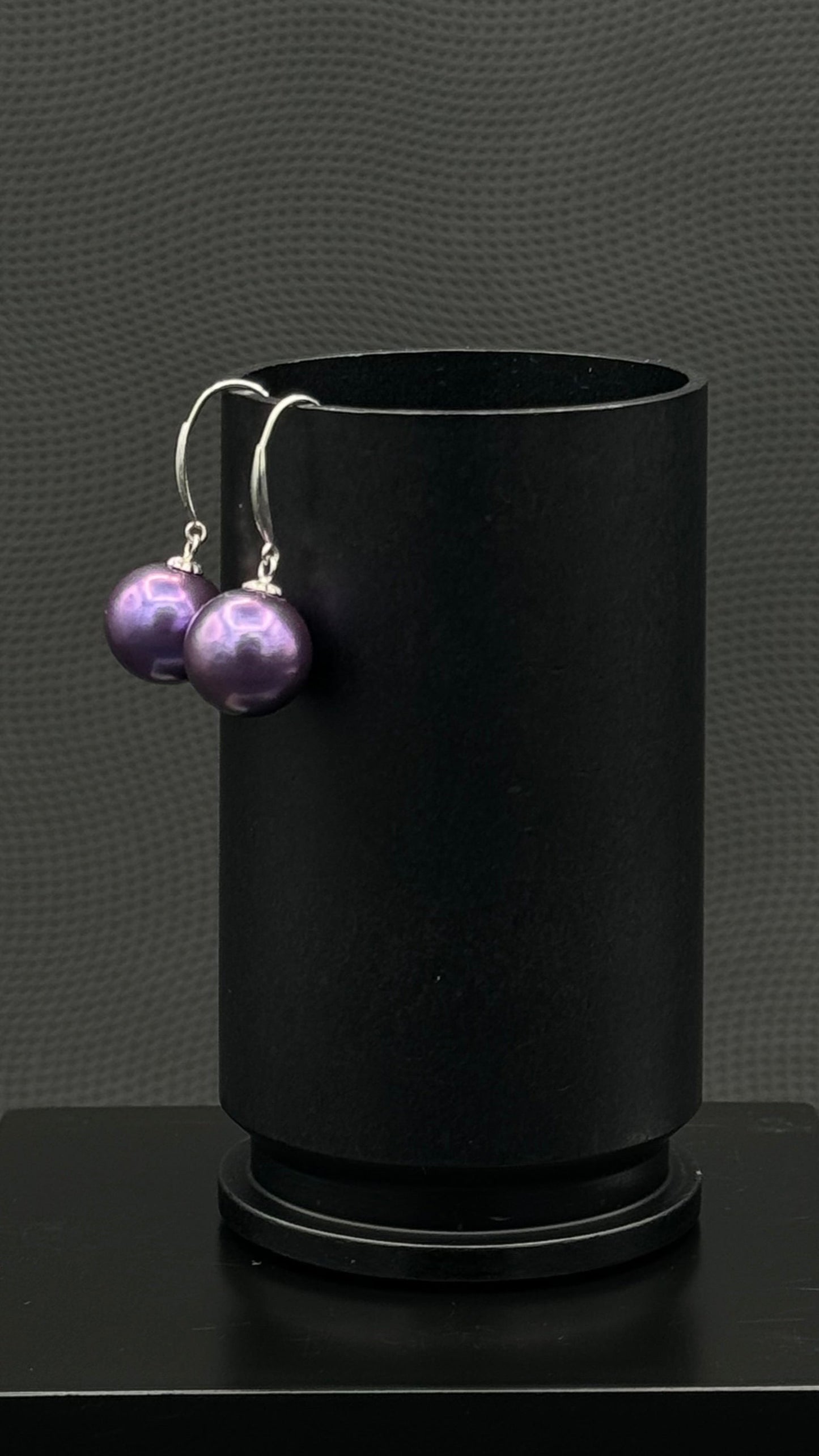 Cultured, Tahitian, pearl earrings, exhibited on black box, blue-purple, drop style, excellent reflection, 10-11mm, 18k white gold.