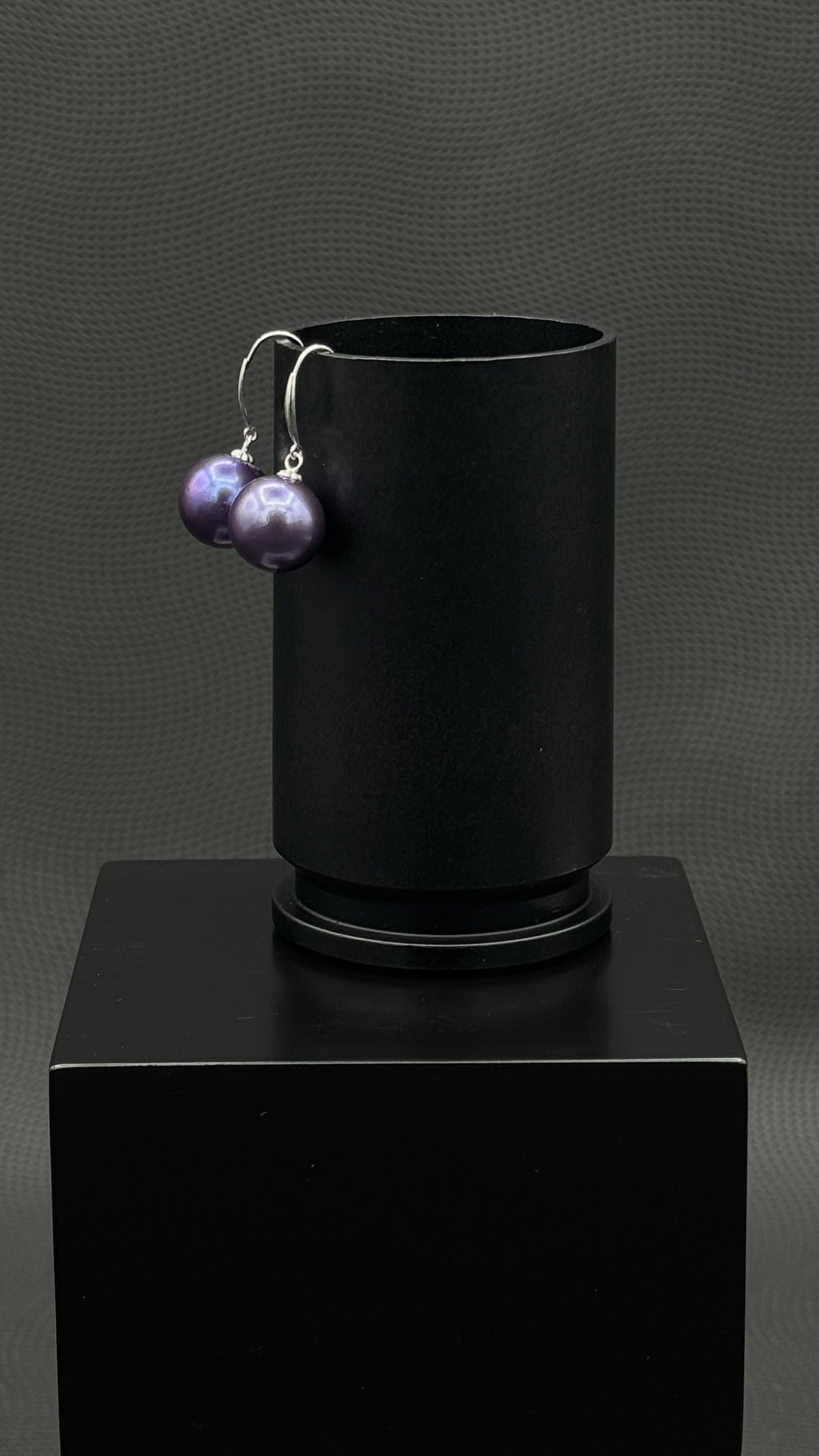 Cultured, Tahitian, pearl earrings, exhibited on black box, purple, drop style, excellent reflection, 10-11mm, 18k white gold.