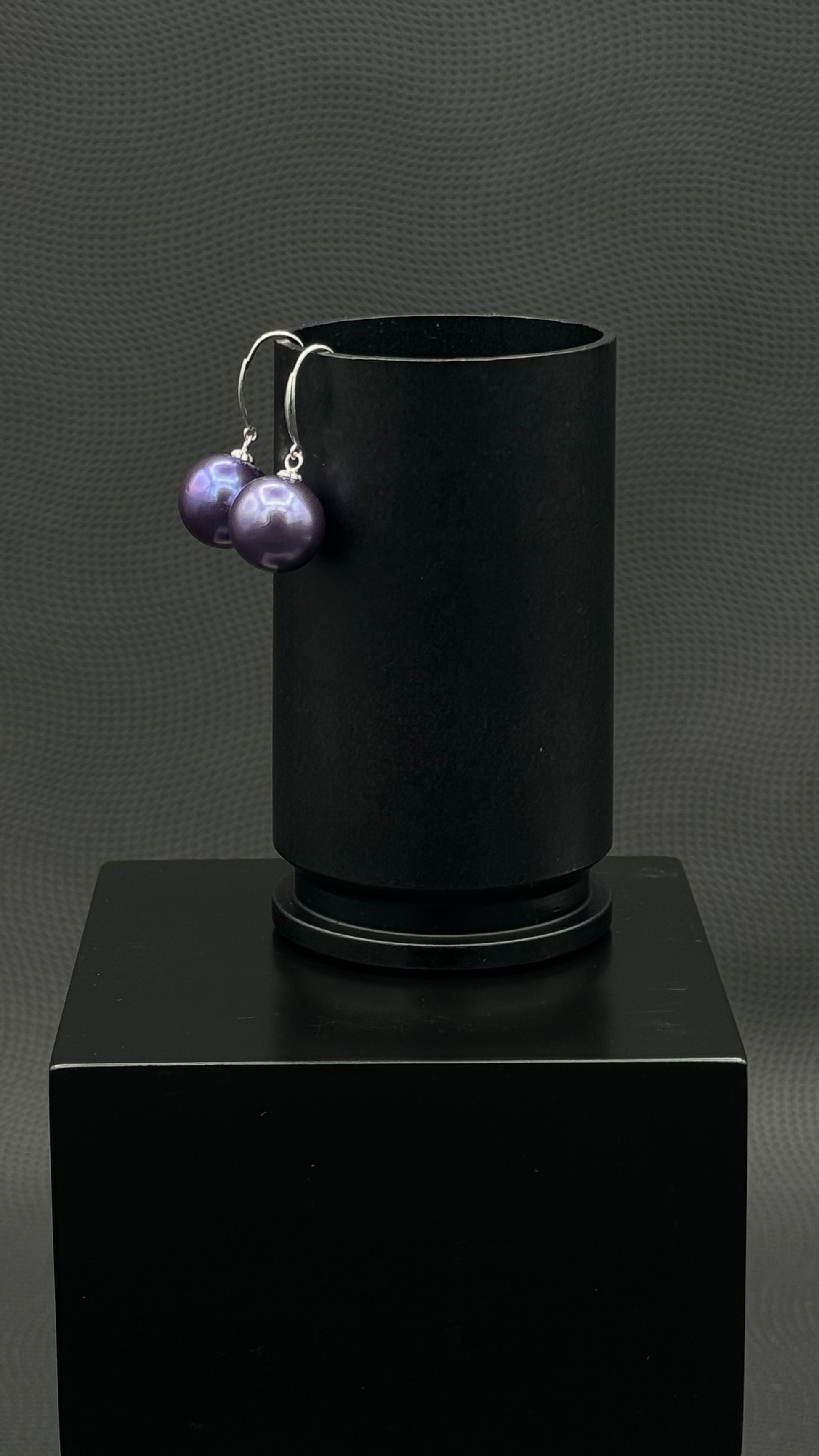 Cultured, Tahitian, pearl earrings, exhibited on black box, purple, drop style, excellent reflection, 10-11mm, 18k white gold.