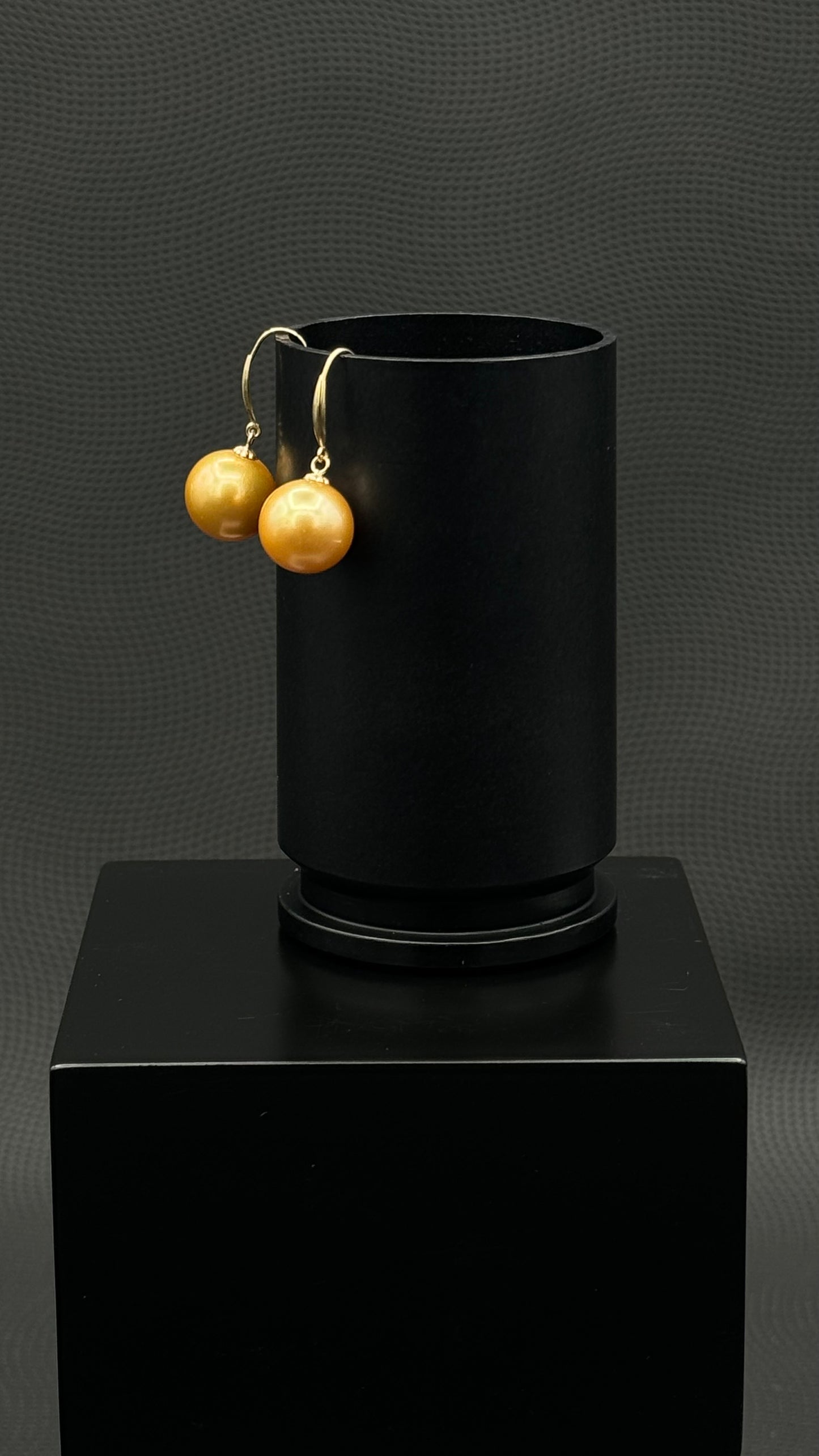 Cultured, South Sea, pearl earrings, exhibited on black box, deep gold, drop style, good reflection, 10-11mm, 18k yellow gold