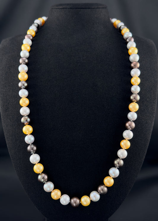 Cultured, South Sea mixed gold-grey-white continuous strand pearl necklace, exhibited on black suede, excellent reflection, 10mm, 26", no clasp.