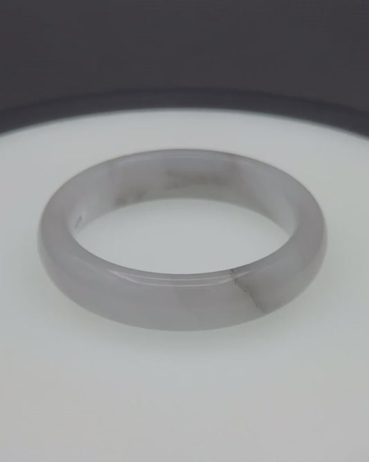 Gray agate bangle with smooth, polished surface and subtle natural banding.