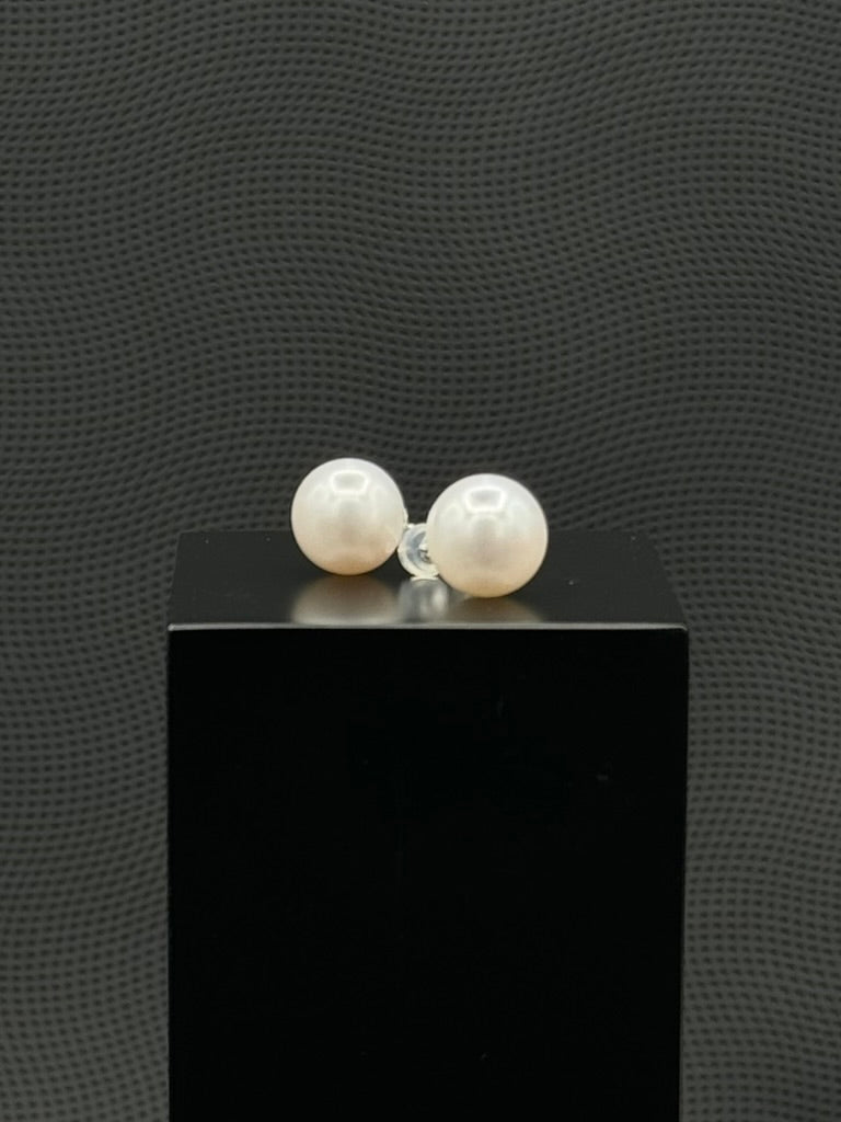 Cultured, South Sea, pearl earrings, exhibited on black box, white, stud style, extremely sharp, 12mm, 18k white gold.