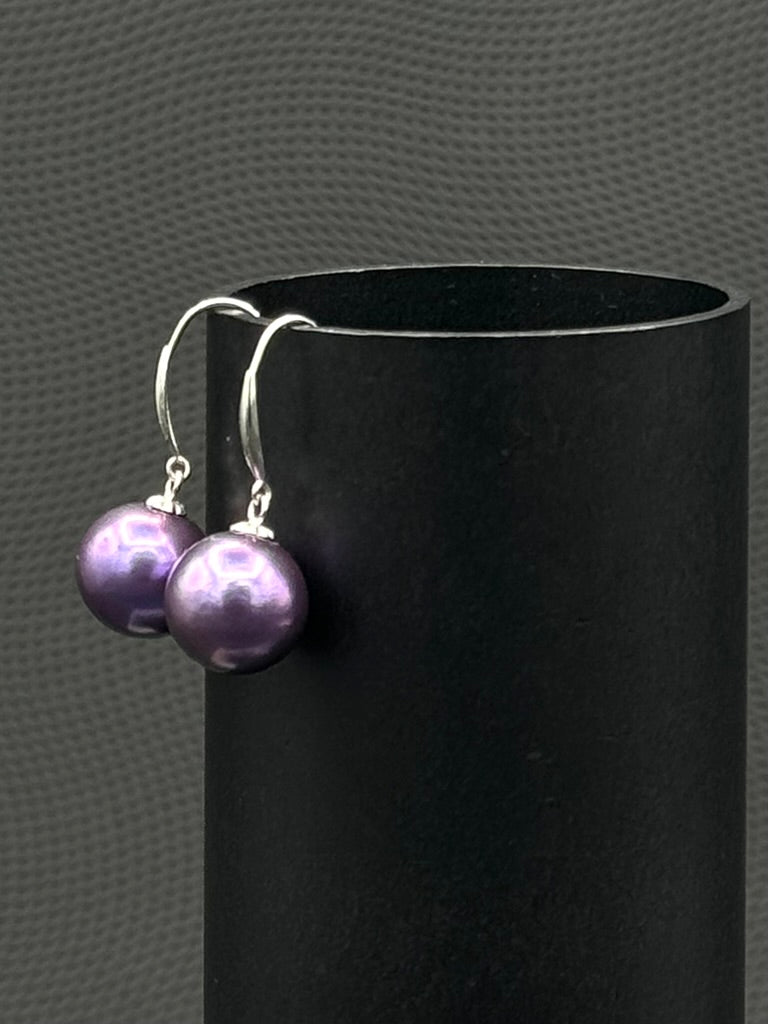Cultured, Tahitian, pearl earrings, exhibited on black cylinder, blue-purple, drop style, excellent reflection, 10-11mm, 18k white gold.