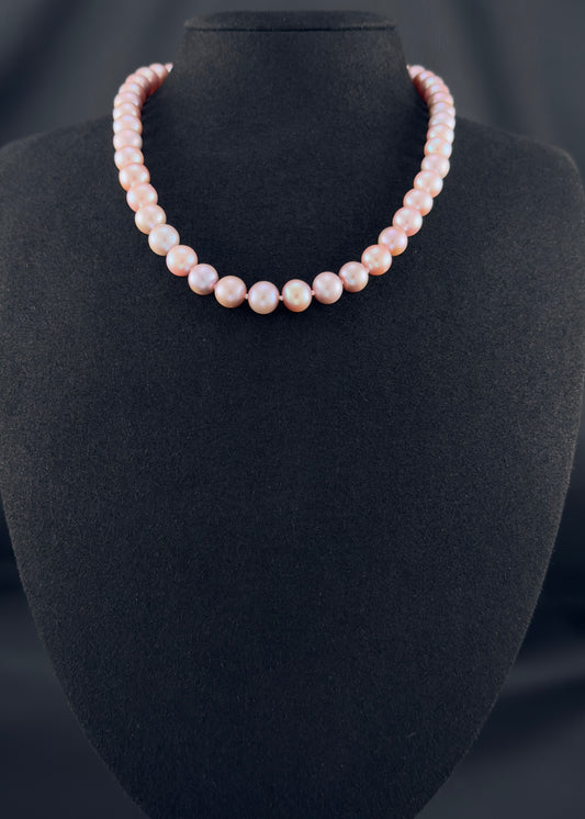 Cultured, South Sea lavender pearl necklace, exhibited on black suede, excellent reflection, 9-10mm, 16", yellow gold clasp.