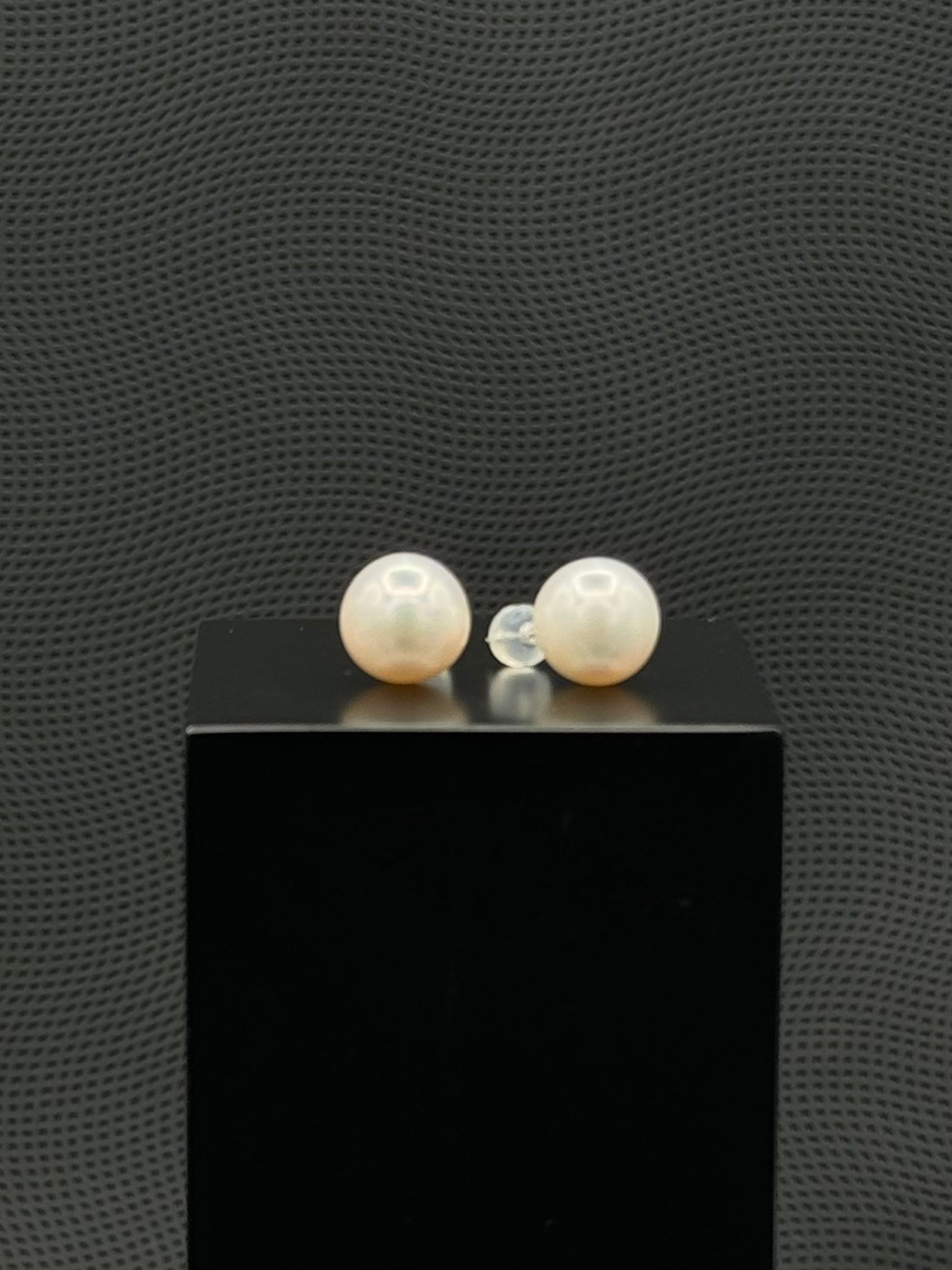 Cultured, South Sea, pearl earrings, exhibited on black box, white, stud style, sound reflection, 11.5mm, 18k white gold.