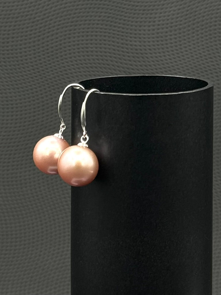 South Sea, Cultured, pearl earrings, exhibited on black cylinder, drop style, light pink, excellent reflection, 11-12mm, 18k white gold.