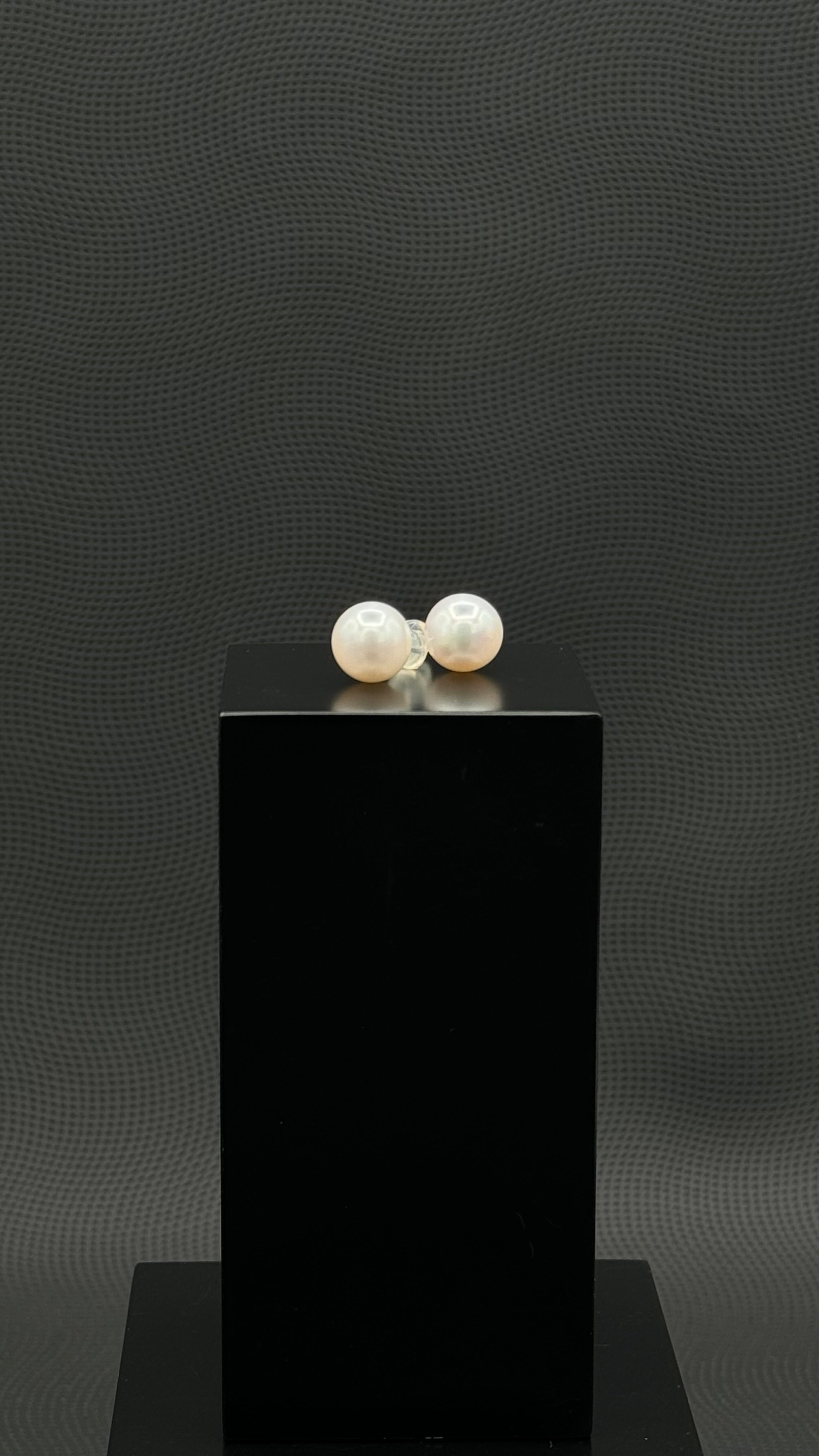 Cultured, South Sea, pearl earrings, exhibited on black box, white, stud style, extremely sharp, 11mm, 18k white gold.