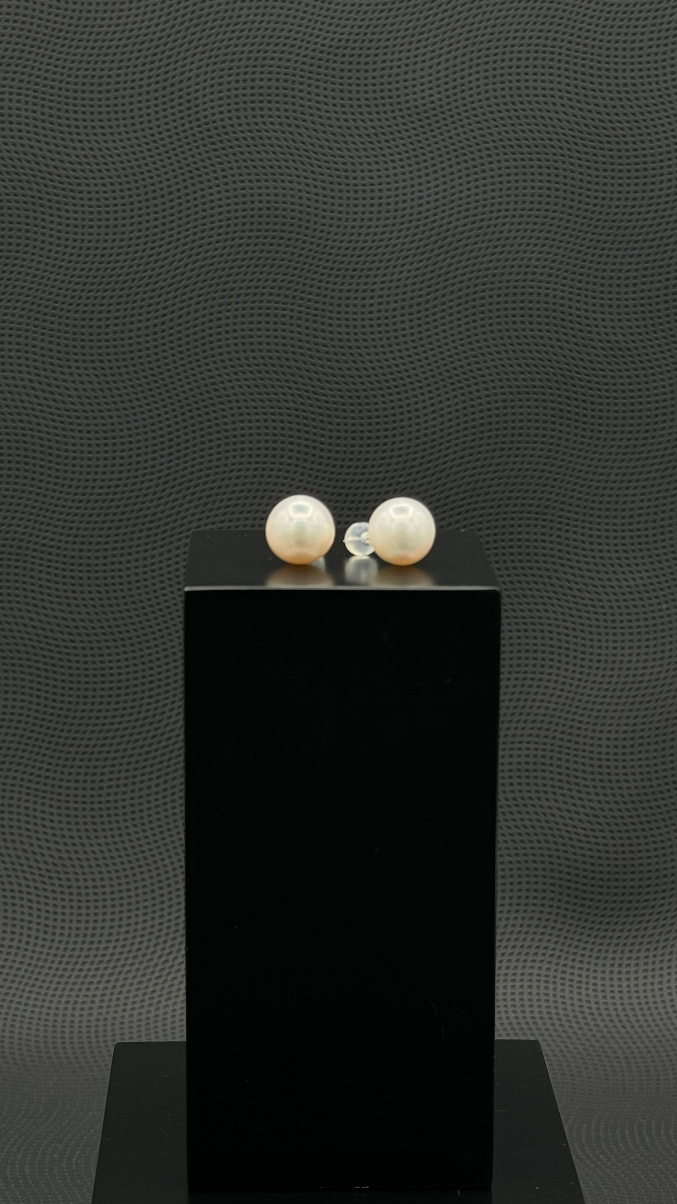 Cultured, South Sea, pearl earrings, exhibited on black box, white, stud style, sound reflection, 11.5mm, 18k white gold.