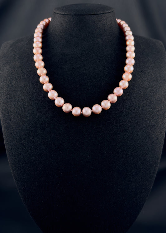 Cultured, South Sea lavender pearl strand necklace, exhibited on black suede, excellent reflection, 9-9.5mm, 18.5", sterling silver clasp.