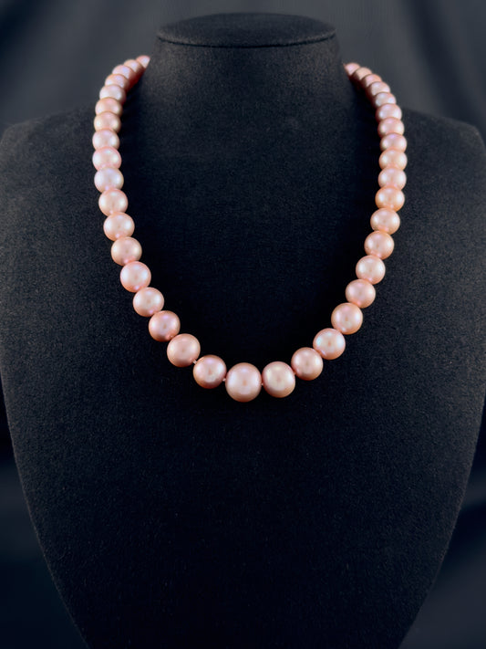 Cultured, South Sea lavender pearl strand necklace, exhibited on black suede, excellent reflection, 9.5-12.5mm, 19", yellow gold clasp.
